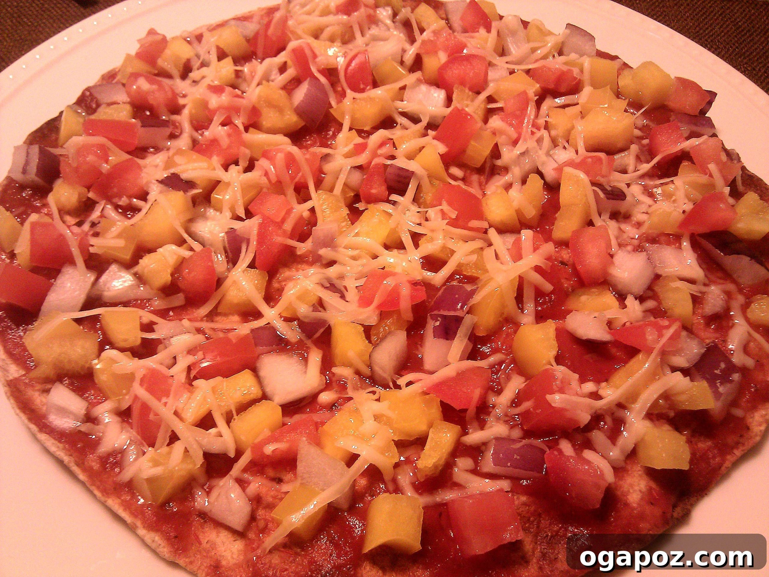 Vegetarian Flatbread Healthy vegetarian flatbread pizza topped with tomato, red onion, bell pepper, and Parmesan cheese