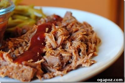 BBQ Pulled Pork Shredded BBQ pulled pork piled high on a bun, ready to serve