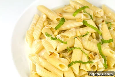 Gorgonzola and Pine Nut Pasta Penne pasta coated in a creamy gorgonzola sauce, garnished with pine nuts