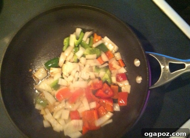 Cook veggies Freshly chopped vegetables, including onions and bell peppers, prepared for Pasta Goulash