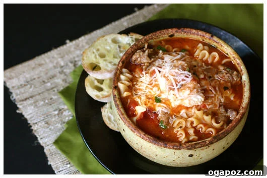 Delicious Lasagna Soup A hearty bowl of Lasagna Soup, featuring pasta, meat sauce, and cheese.