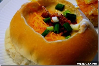 Baked Potato Soup Creamy Baked Potato Soup, garnished with cheese, bacon, and green onions.