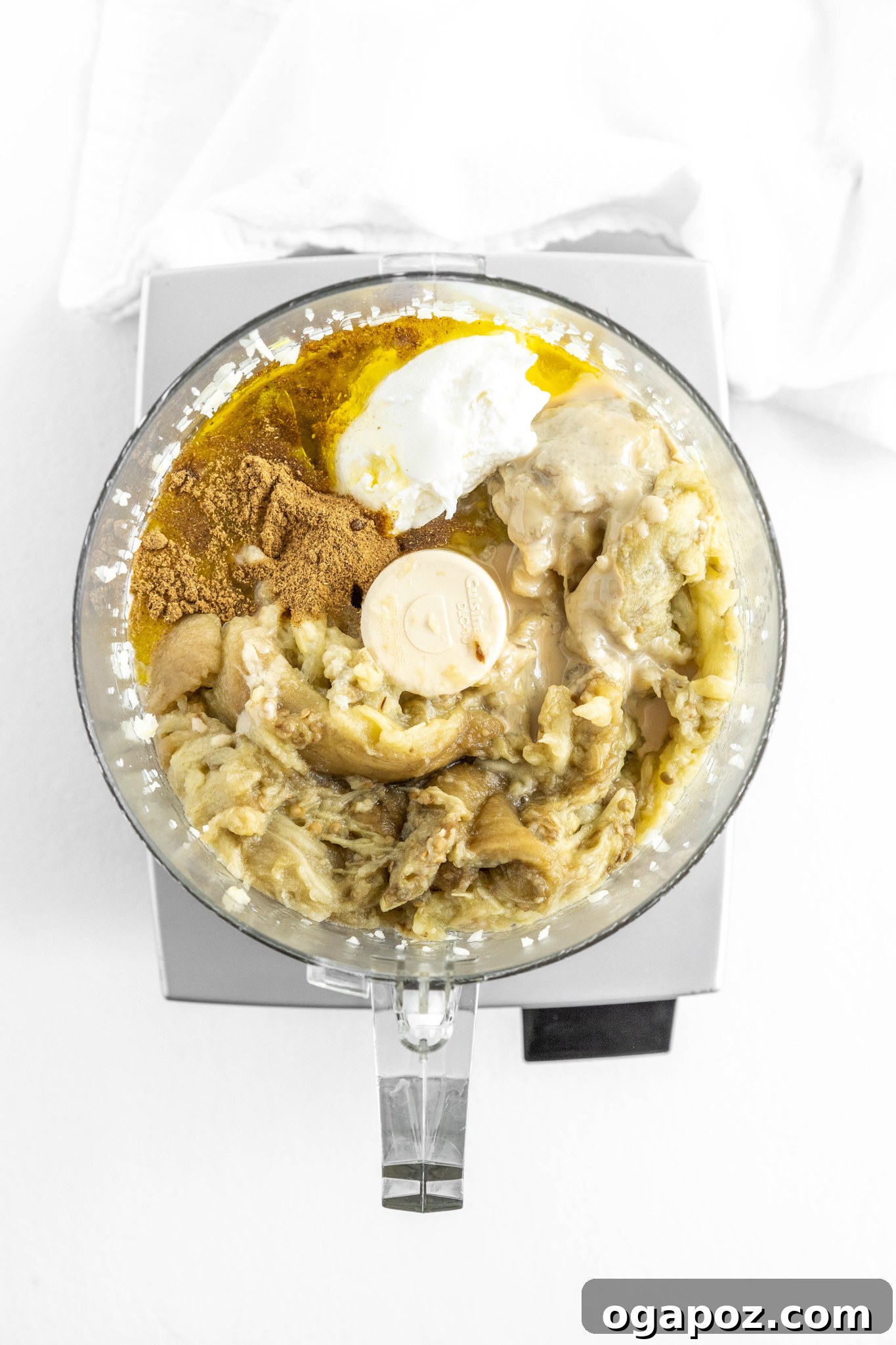 Smoky Roasted Eggplant Dip 9 Baba Ghanoush ingredients being pureed in a food processor.
