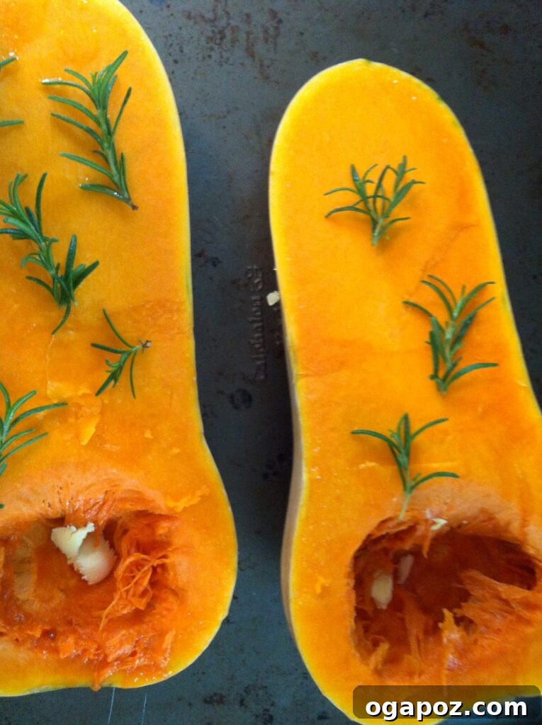 Golden Roasted Butternut Bliss 4 Butternut squash halves with butter and fresh rosemary sprigs ready for roasting