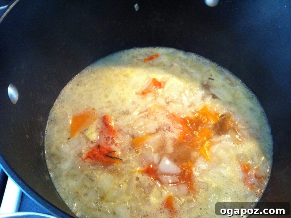 Golden Roasted Butternut Bliss 6 Butternut squash, onions, garlic, and chicken broth simmering in a pot for soup