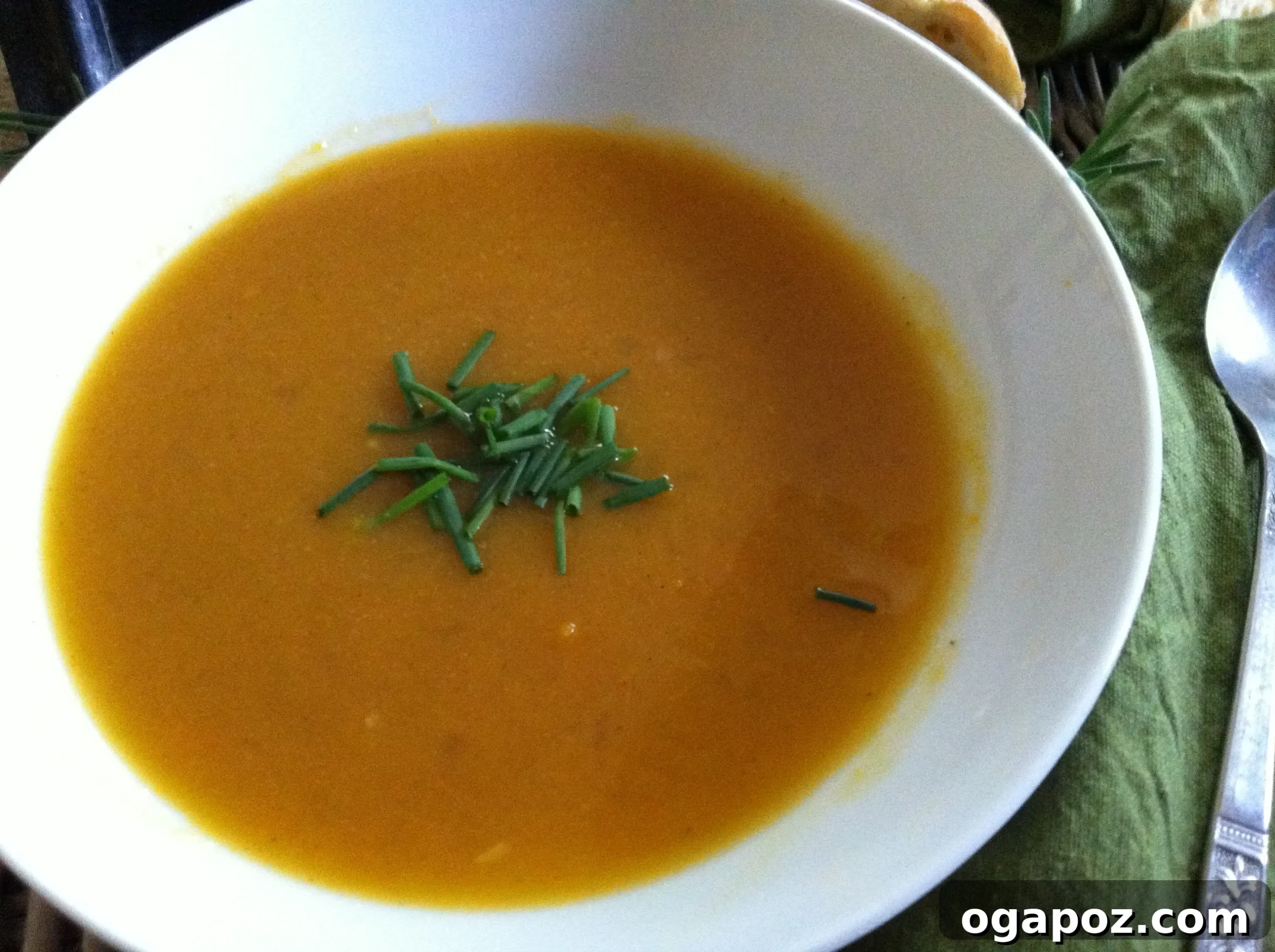 Golden Roasted Butternut Bliss 9 A serving of Roasted Butternut Squash Soup with crusty bread