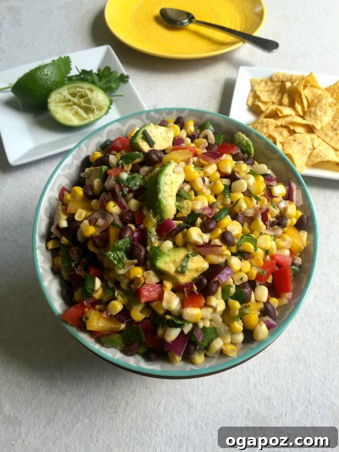Sunshine Corn and Black Bean Delight 2 Vibrant Sweet Corn Black Bean Salad in a rustic white bowl, garnished with fresh cilantro, perfect for a summer gathering