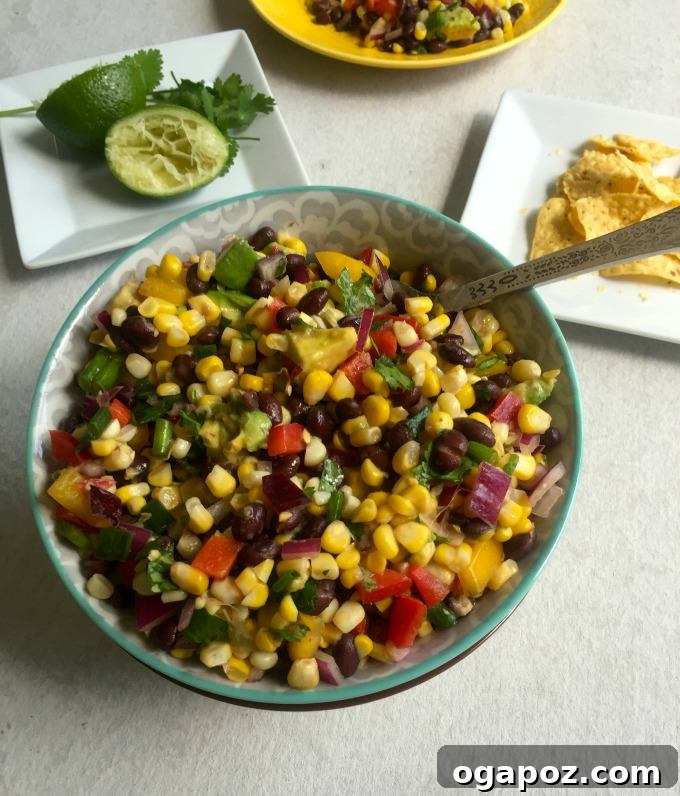 Sunshine Corn and Black Bean Delight 7 A single serving of Sweet Corn Black Bean Salad in a small white bowl, ready to be enjoyed with a spoon