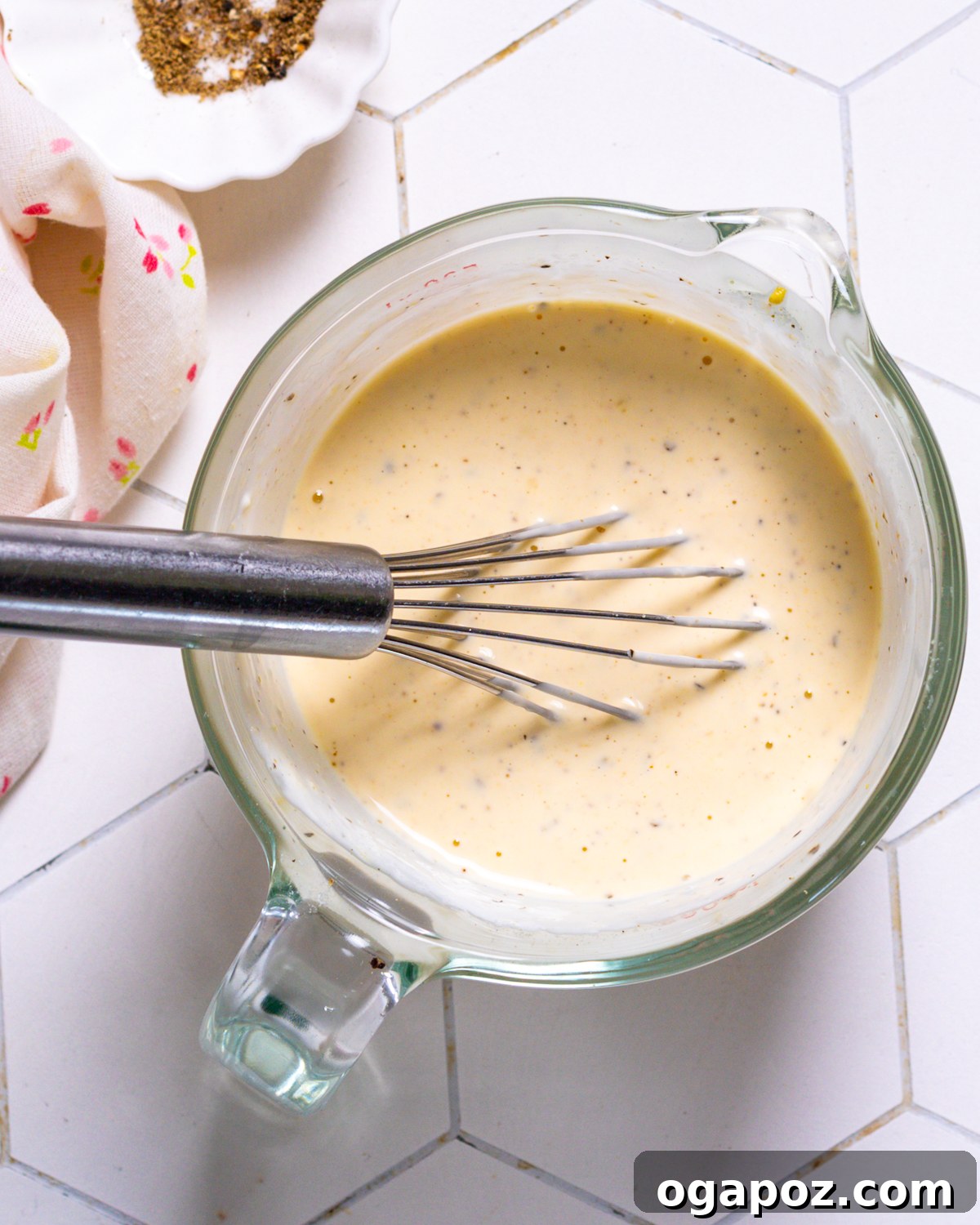 Homestyle Creamy Potato and Egg Salad 7 Whisking together a creamy, tangy dressing with mayonnaise, Greek yogurt, lemon, and seasonings for a delicious potato salad.