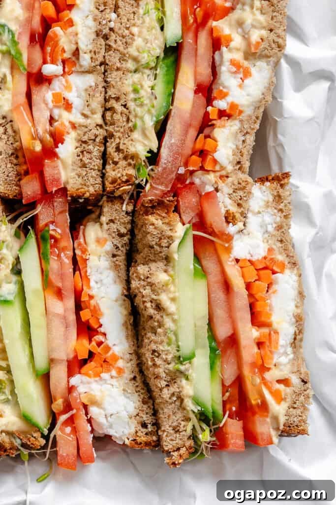 Two halves of a Mediterranean Vegetable Sandwich served side by side.