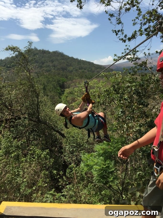Tamarindo: Costa Rica's Pacific Paradise 13 Couple ziplining through a lush Costa Rican forest with tropical vegetation
