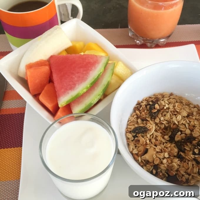 Delicious tropical breakfast spread with fresh fruit, eggs, and toast at 15 Love B&B