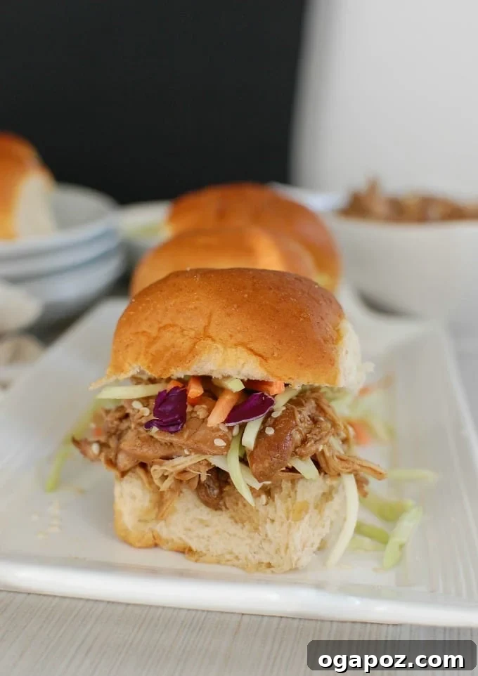 Sweet & Sticky Slow Cooker Honey Sesame Chicken Sliders 2 Slow Cooker Asian Honey Sesame Chicken Sliders - yum