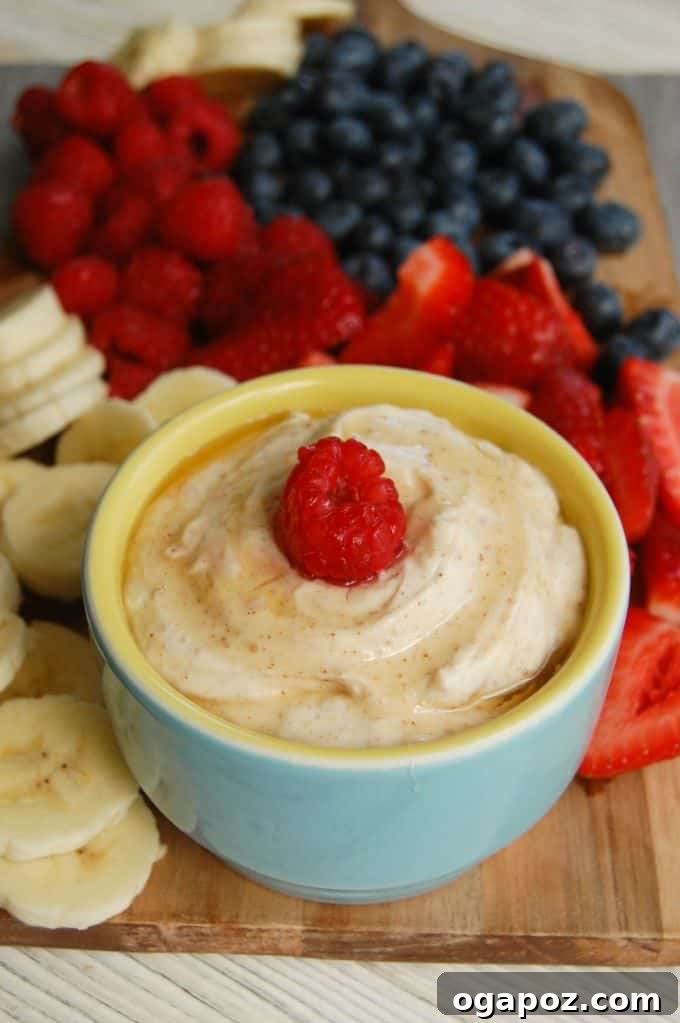 Velvet Yogurt Fruit Dip 3 Close-up of creamy Yogurt Fruit Dip in a small white bowl, ready for dipping