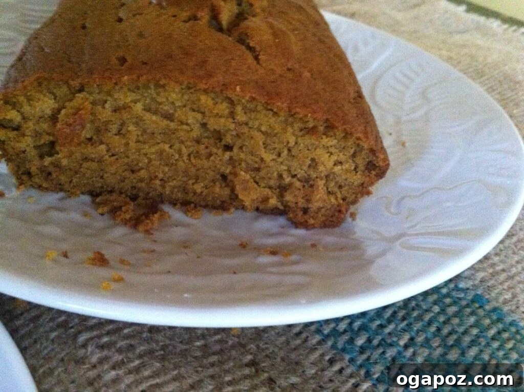 Slices of freshly baked pumpkin bread on a cutting board