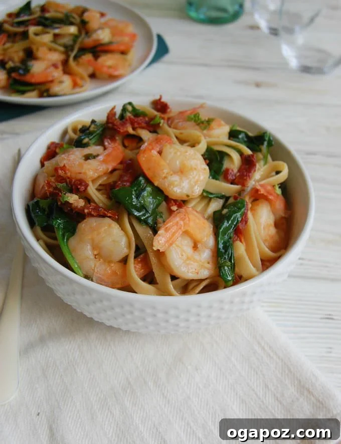 Effortless Garlic Shrimp Scampi 5 Easy Shrimp Scampi Recipe in a white bowl, presented elegantly with a napkin.