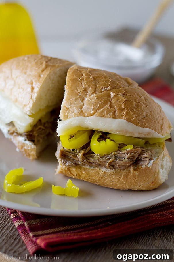 Effortless Slow Cooker Dinners for Busy School Nights 5 Classic Italian beef sandwiches featuring thinly sliced seasoned beef, drenched in flavorful jus, piled onto crusty bread.
