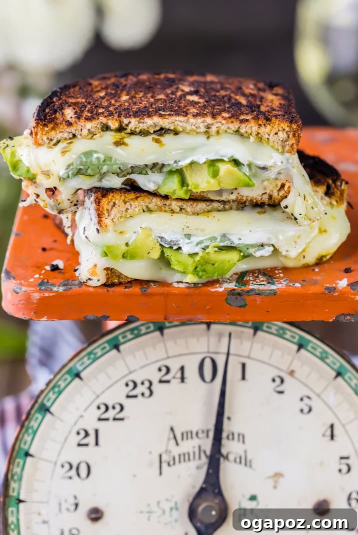 12 Superfood Avocado Recipes 13 Green Goddess Grilled Cheese, a cheesy sandwich infused with fresh green ingredients, possibly including avocado, herbs, and green vegetables.
