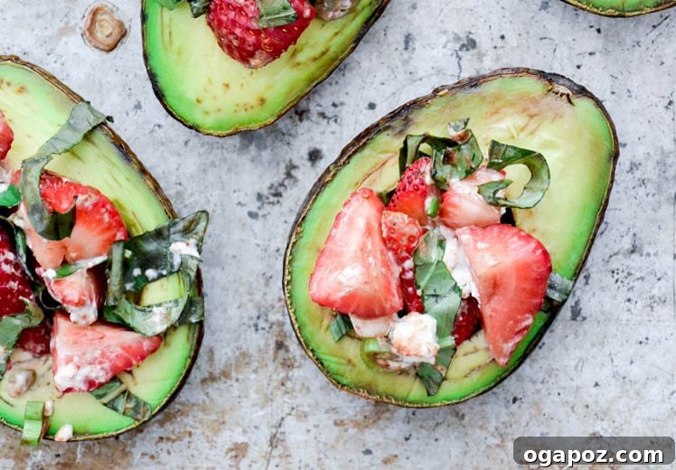 12 Superfood Avocado Recipes 14 Baked Avocados with Strawberry Salsa, showcasing halved avocados baked and then topped with a fresh, vibrant strawberry salsa.