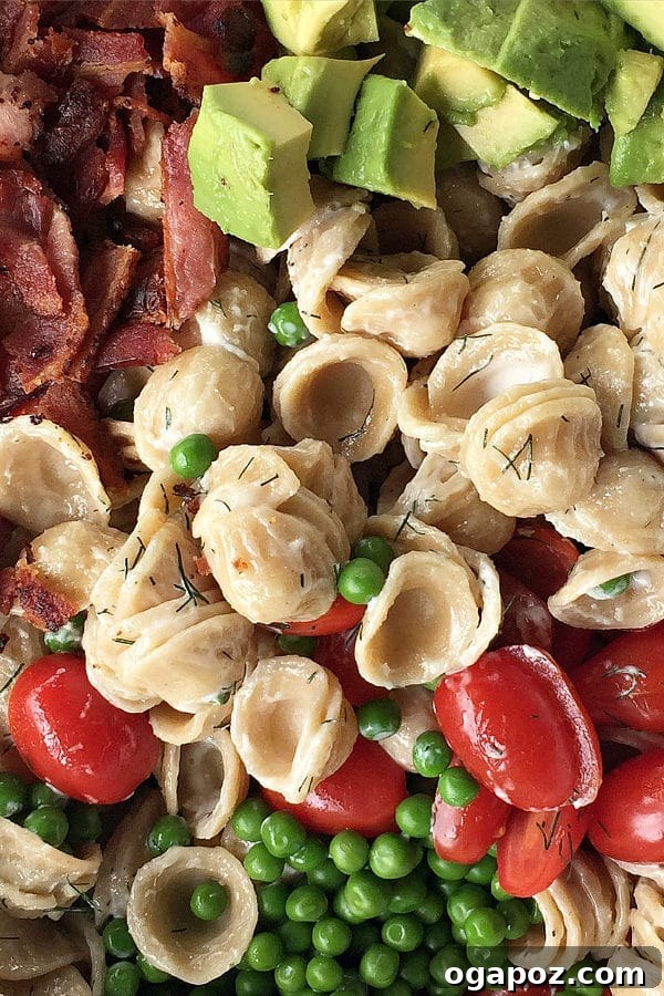 12 Superfood Avocado Recipes 6 Summer Avocado Pasta Salad, a vibrant and refreshing pasta salad tossed with fresh avocado, vegetables, and a light dressing.