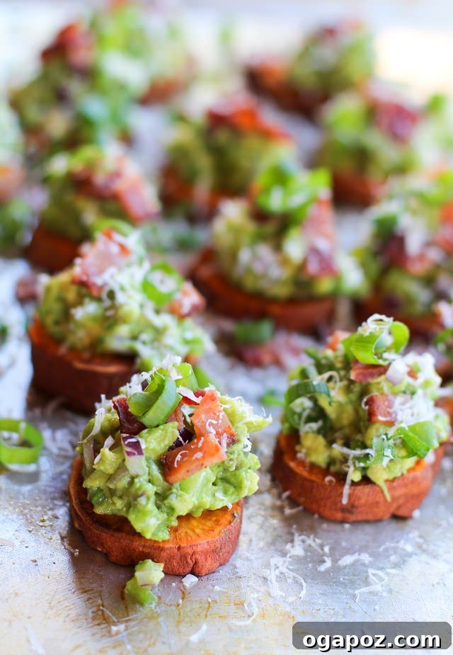 12 Superfood Avocado Recipes 10 Roasted Sweet Potato Rounds with Guacamole and Bacon, an appetizer featuring crispy sweet potato slices topped with creamy guacamole and crumbled bacon.