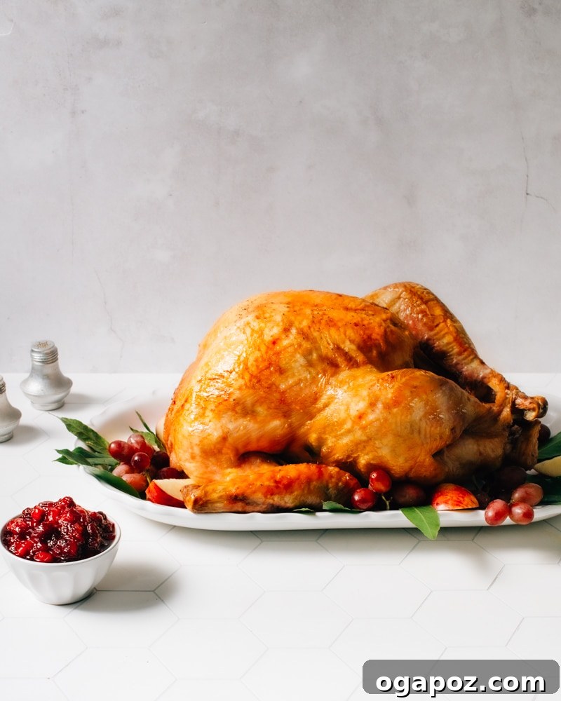 The Ultimate Stress Free Thanksgiving Dinner Roadmap 2 A beautifully set Thanksgiving table, showcasing a golden roasted turkey surrounded by festive decorations.