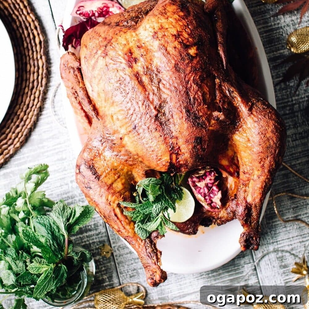 The Ultimate Stress Free Thanksgiving Dinner Roadmap 4 A whole roasted Tandoori Turkey, beautifully golden and spiced, presented on a platter with fresh herbs.