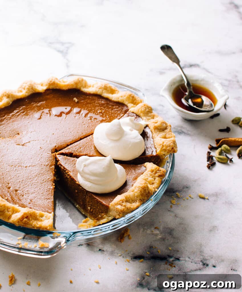The Ultimate Stress Free Thanksgiving Dinner Roadmap 5 A slice of homemade pumpkin pie, rich and creamy, served with a dollop of whipped cream and a sprinkle of cinnamon.