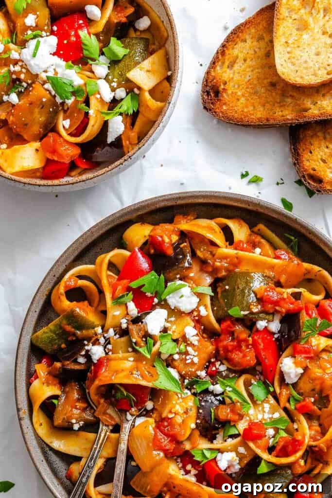 Provencal Garden Pappardelle 11 A beautifully presented bowl of Ratatouille Pappardelle with a fork inserted, ready to be enjoyed, highlighting its appeal for meal prepping.