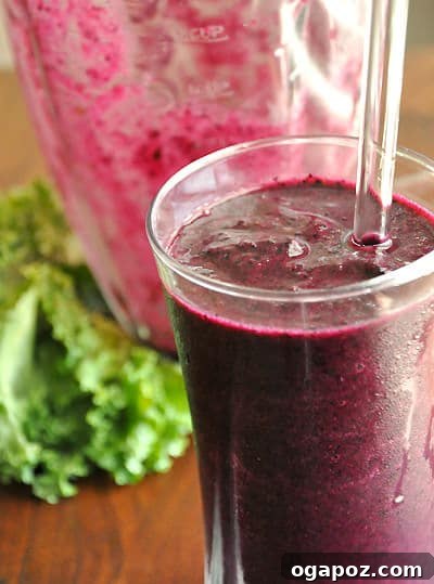 9 Amazing Blueberry Superfood Smoothies 7 A rich, deep purple-colored smoothie, aptly named the Purple Powerhouse Smoothie, served in an elegant glass, promising a robust nutrient profile.