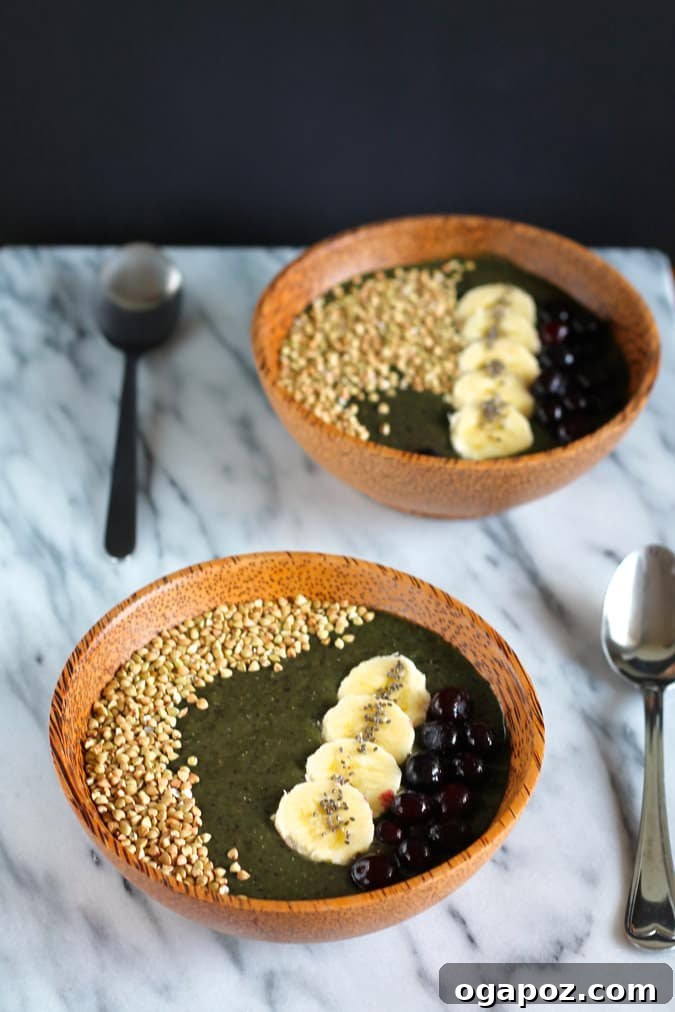 9 Amazing Blueberry Superfood Smoothies 8 A beautifully garnished Blueberry Buckwheat Smoothie Bowl, topped generously with fresh blueberries, crunchy nuts, and wholesome seeds, showcasing its appealing texture and health benefits.