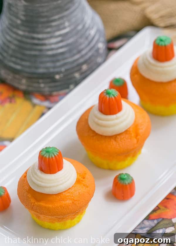 Harvest Stripe Cupcakes 3 Close-up of Candy Corn Cupcakes showing the distinct yellow, orange, and white layers.