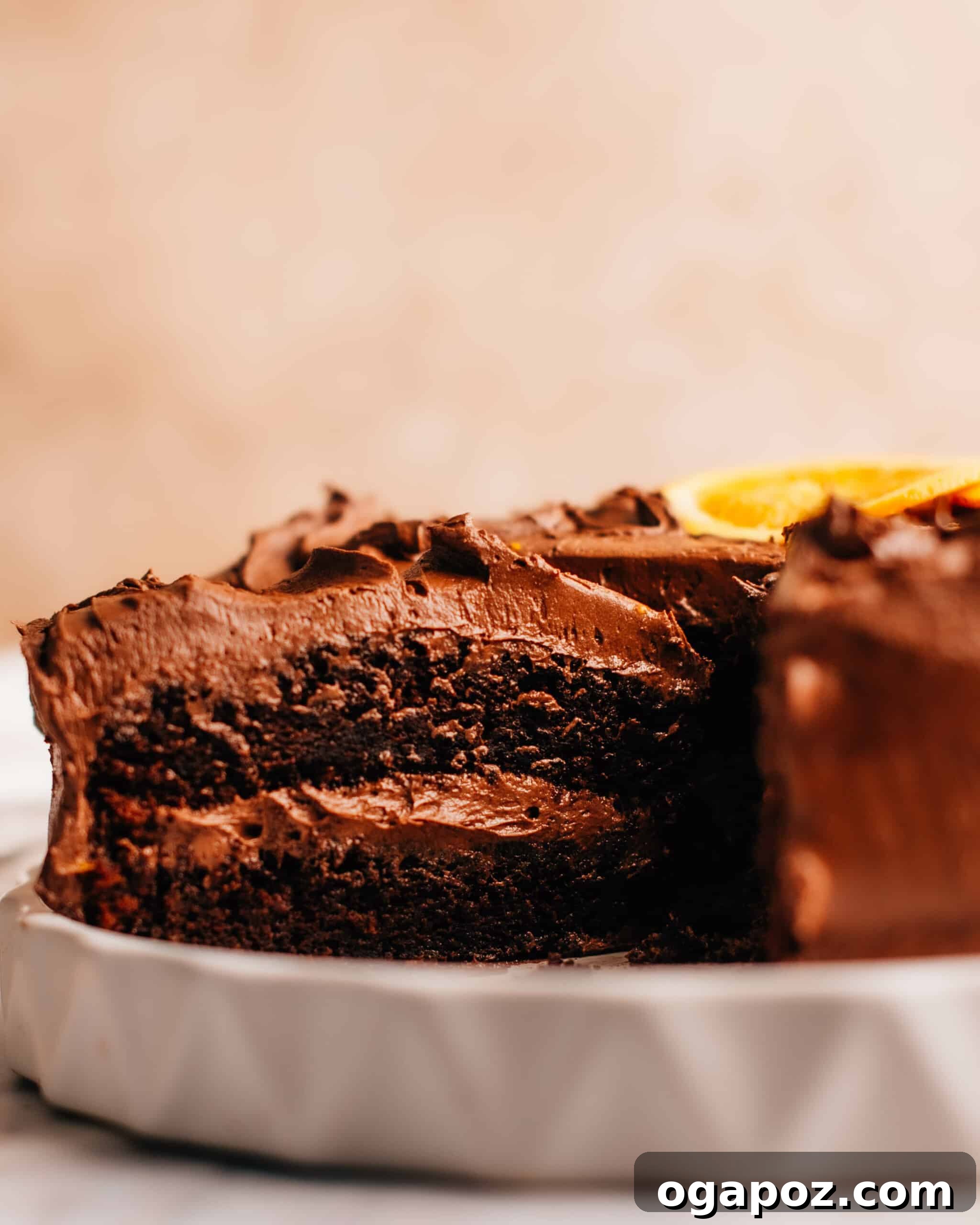 Effortless Chocolate Christmas Delights 13 A slice being cut from a Moist Chocolate Orange Cake, revealing its tender crumb and rich color.