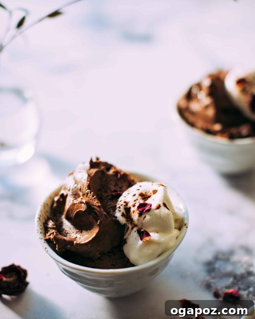 Effortless Chocolate Christmas Delights 19 A bowl of light and fluffy Blender Chocolate Mousse, elegantly topped with whipped cream.