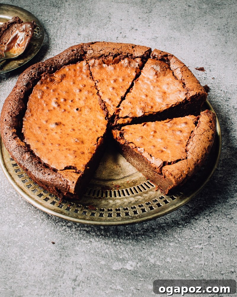 Effortless Chocolate Christmas Delights 6 Slices of rich, fudgy Flourless Chocolate Cake on a serving platter, ready to be enjoyed.