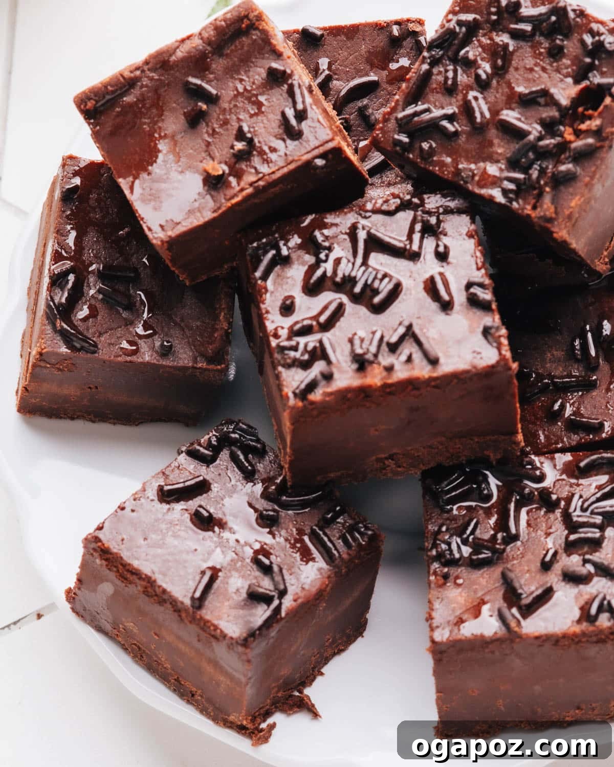 Effortless Chocolate Christmas Delights 8 Smooth and creamy 2-Ingredient Chocolate Fudge squares, ready for gifting or serving.