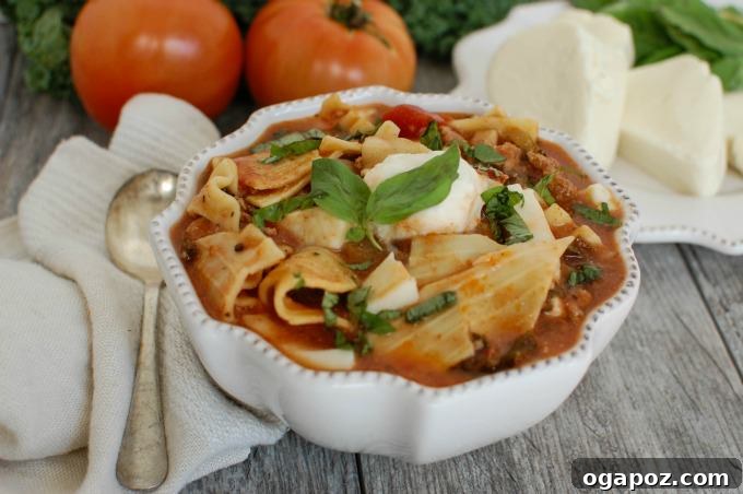 Lazy Lasagna Soup with Turkey and Kale 4 A close-up of a pot of Slow Cooker Turkey Kale Lasagna Soup simmering, ready for dinner.