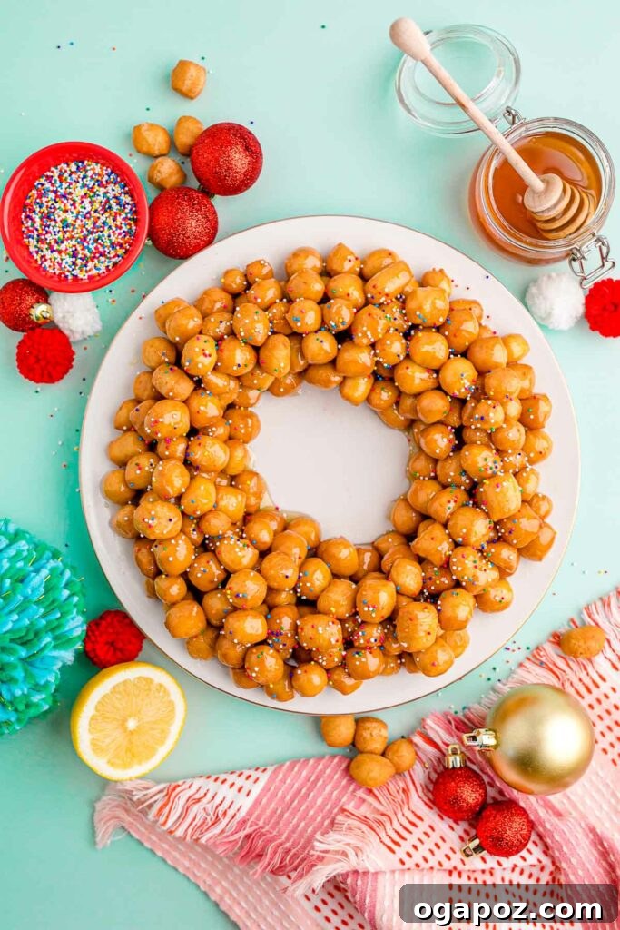 15 Italian Christmas Dessert Delights 9 A festive mound of glistening honey balls (Struffoli) generously decorated with colorful rainbow sprinkles, creating a cheerful display.