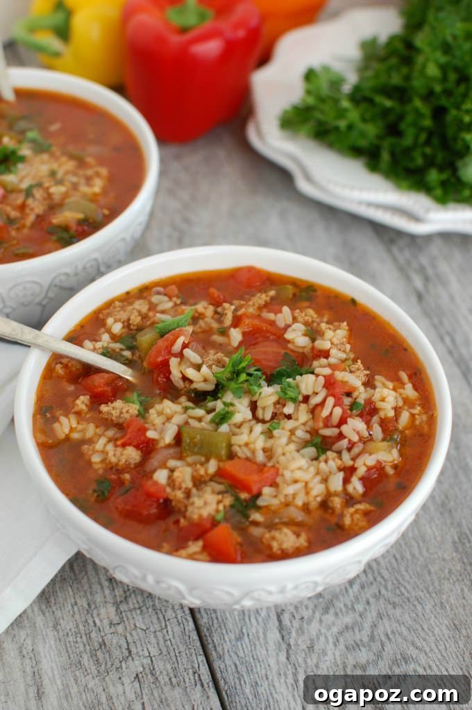 Close-up of Slow Cooker Stuffed Pepper Soup in a bowl, showcasing the rich colors and textures.