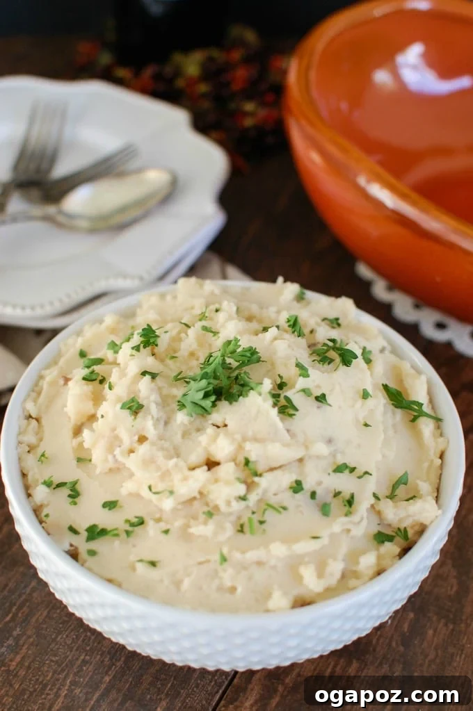 Slow Cooker Gouda Mashed Potatoes, a creamy and flavorful side dish perfect for holidays