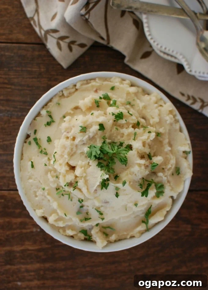 Close-up of creamy Slow Cooker Gouda Mashed Potatoes, showcasing their rich texture