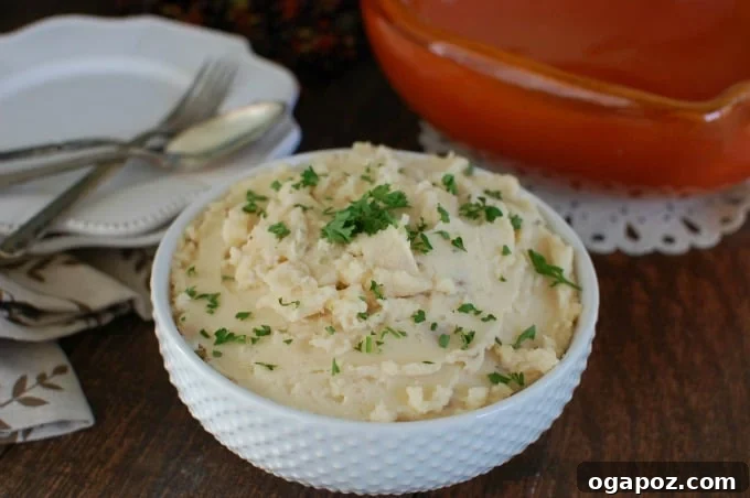 Slow Cooker Gouda Mashed Potatoes ready to be served, a perfect comfort food