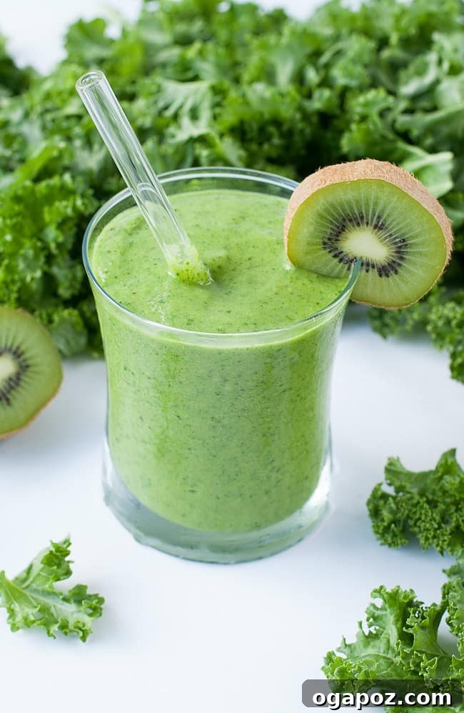 Bright green Tropical Mango Kale Smoothie in a glass, featuring mango and kale