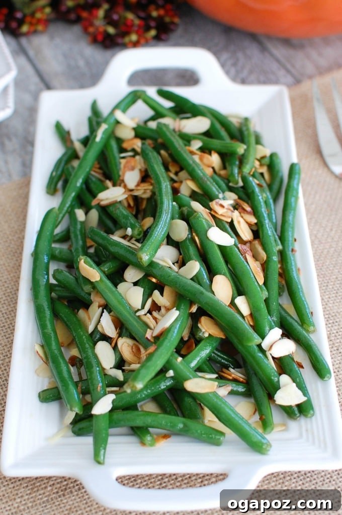Golden Brown Butter Green Beans with Toasted Almonds 3 Fresh Green Beans with Brown Butter and Toasted Almonds ingredients laid out, showcasing their simplicity.