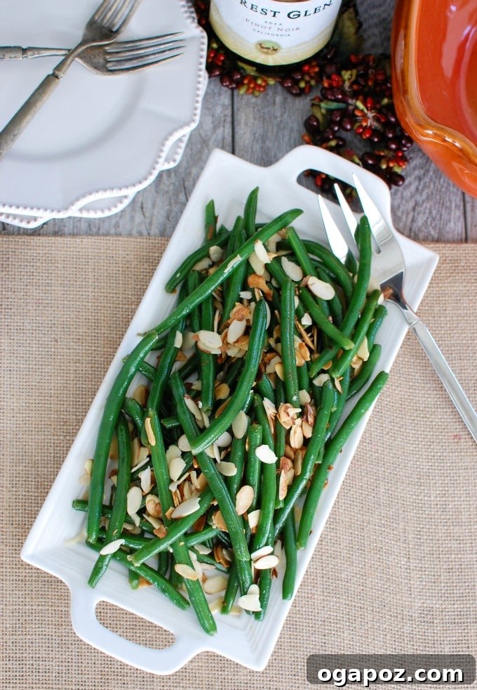 Golden Brown Butter Green Beans with Toasted Almonds 4 Cooked Green Beans with Brown Butter and Toasted Almonds, beautifully plated and ready to serve as an easy side dish.