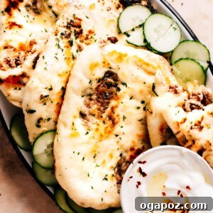 Spiced Keema Naan: Pillowy Flatbreads Bursting with Flavor 7 A perfectly cooked Keema Naan, golden brown and slightly puffed, ready to be served and enjoyed.