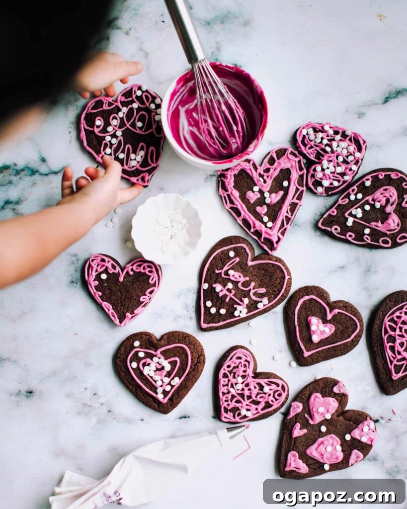 Sweetheart Sugar Cookies Effortless Valentine's Delights 2 decorated chocolate sugar cookies on a kitchen countertop