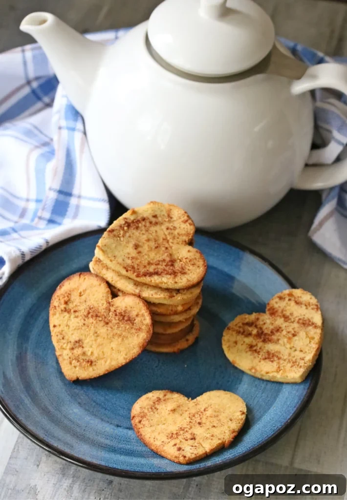 Sweetheart Sugar Cookies Effortless Valentine's Delights 10 cinnamon sugar cookies stacked on a plate with tea pot