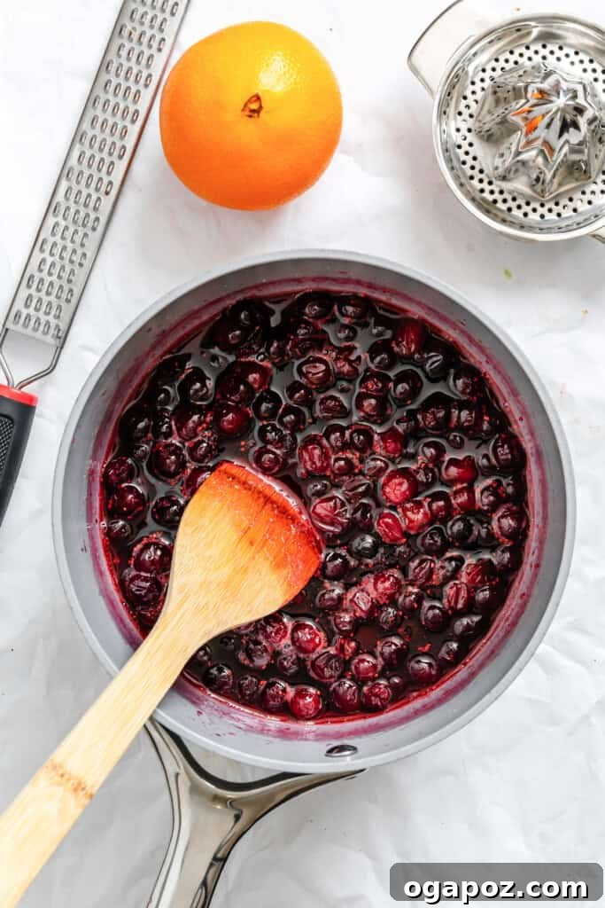 Sweet and Tart Brie Cranberry Naan 8 Cranberry sauce simmering in a pot