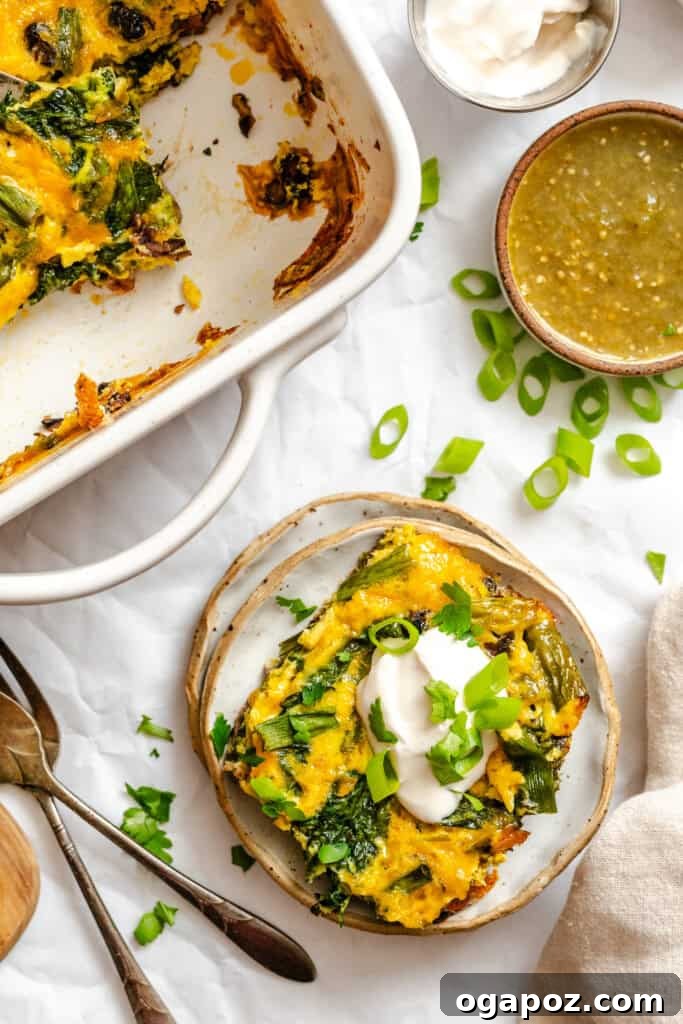 Tex-Mex Black Bean Egg Casserole with Zesty Verde 7 A serving of Cheesy Black Bean Egg Bake on a plate with a fork, ready to be eaten.
